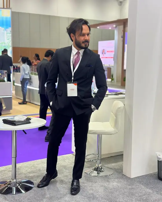 Ayoub at an exhibition stand